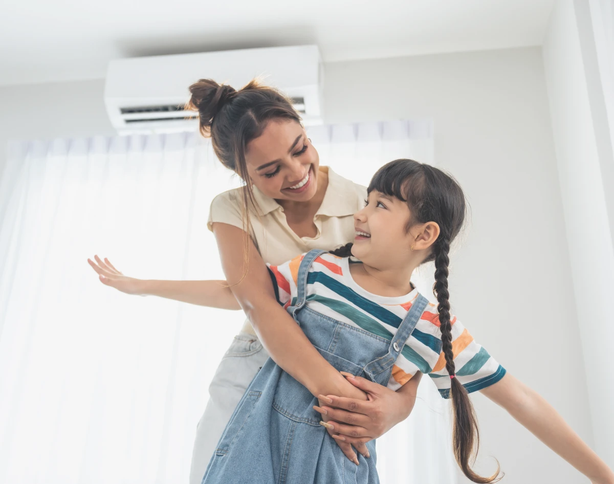 Happy family bonding in air-conditioned room