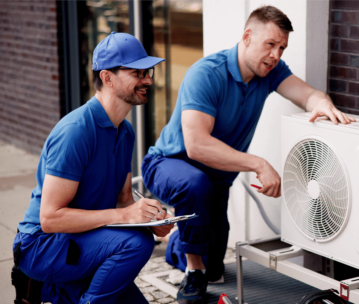 Maintenance team checking air conditioning system